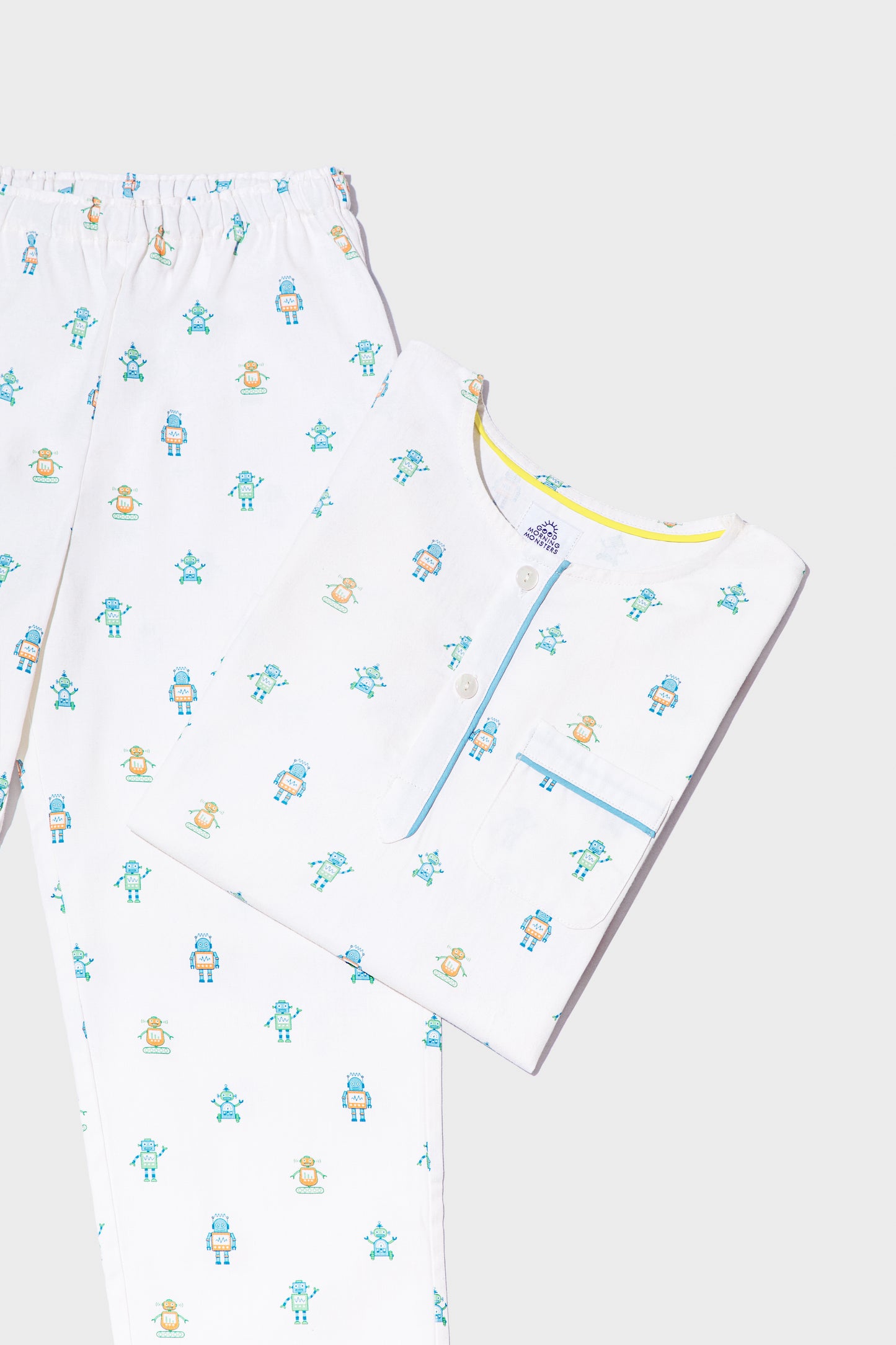front view of robot print pajamas top and bottoms; good morning monsters woven pajamas, loungewear, sleepwear, loose-fitting pajamas, boys, girls, baby, unisex