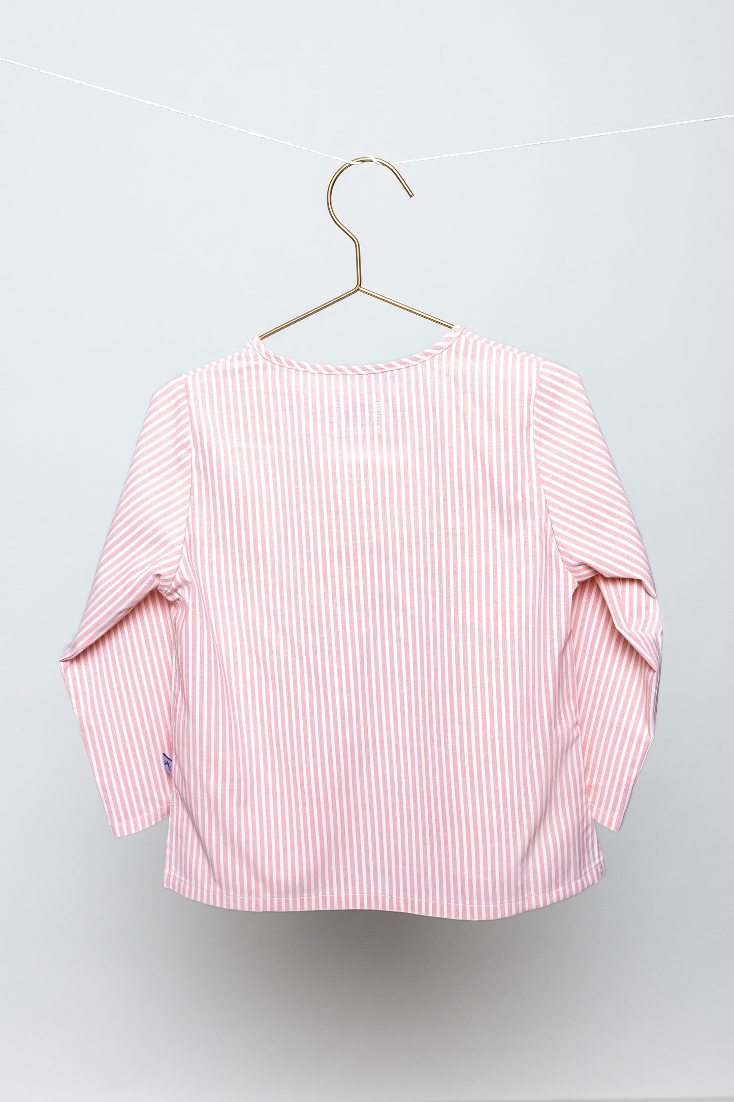 back view of pink and white pinstripes pajama top, good morning monsters woven pajamas, loungewear, sleepwear, loose-fitting pajamas, boys, girls, baby, unisex