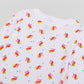 View of Pajama Set - Close up of unicorn print (with colorful unicorns, blue stars, and blue GMM logos). 
 Pajamas are white fabric with a vibrant unicorn print.  Pajamas are long-sleeved and made from GOTS certified, 100% organic cotton.
good morning monsters pajamas, loungewear, sleepwear, pajamas, boys, girls, baby, unisex