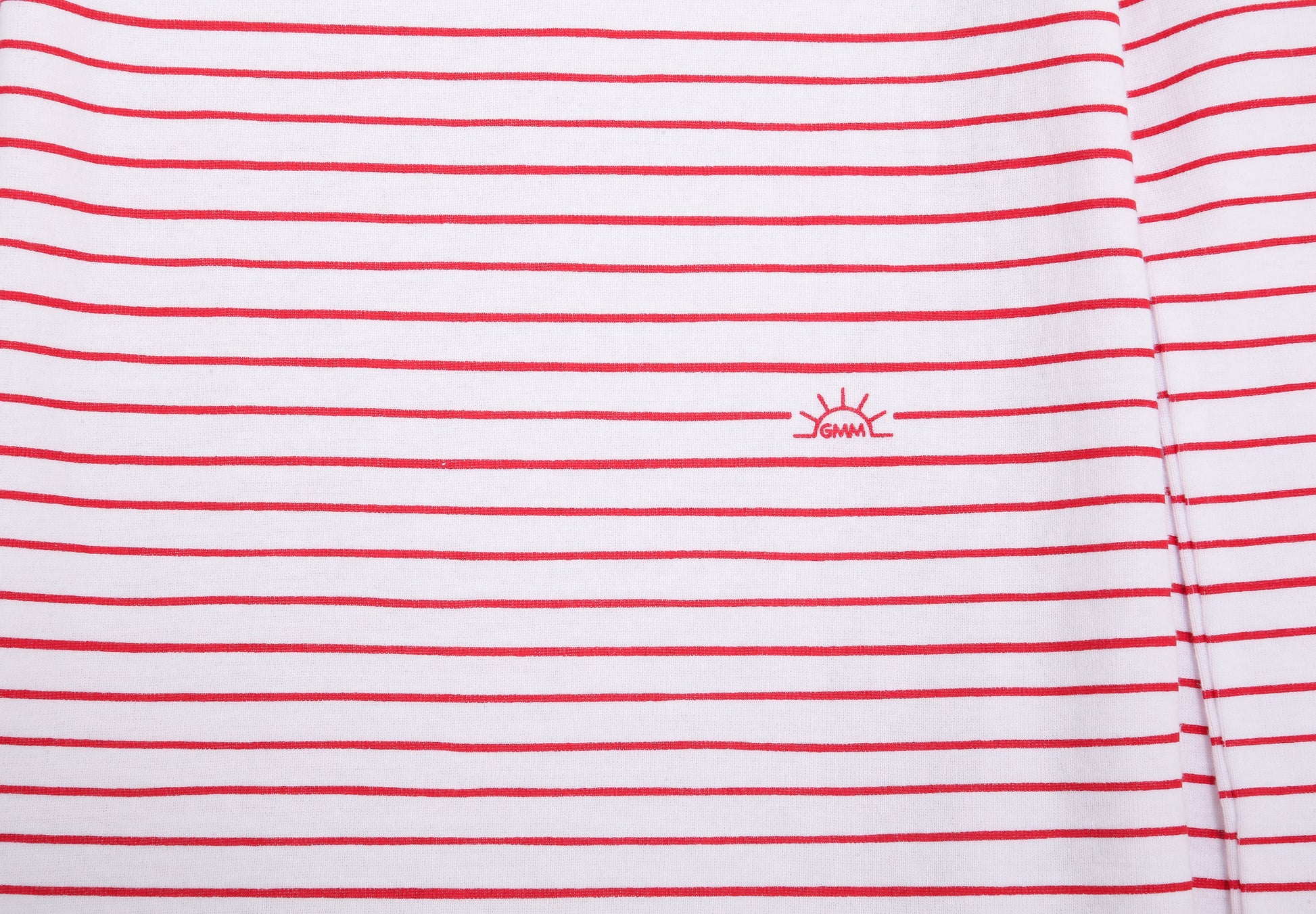 View of Pajama Set - Close up of red stripes print (with playful red stripes and our GMM logos also in red). 
 Pajamas are white fabric with the red stripes print.  Pajamas are long-sleeved and made from 100% GOTS certified organic cotton.
good morning monsters pajamas, loungewear, sleepwear, pajamas, boys, girls, baby, unisex