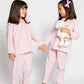 two models wearing pink and white pinstripe pajamas (one model is holding jellycat doll), good morning monsters woven pajamas, loungewear, sleepwear, loose-fitting pajamas, boys, girls, baby, unisex