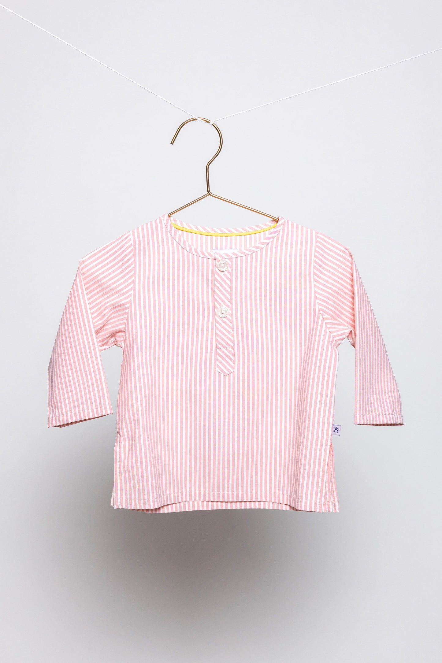 front view of pink and white pinstripes pajama top, good morning monsters woven pajamas, loungewear, sleepwear, loose-fitting pajamas, boys, girls, baby, unisex