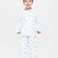 model wearing robots print pajamas (solid white fabric with colorful robots), good morning monsters woven pajamas, loungewear, sleepwear, loose-fitting pajamas, boys, girls, baby, unisex