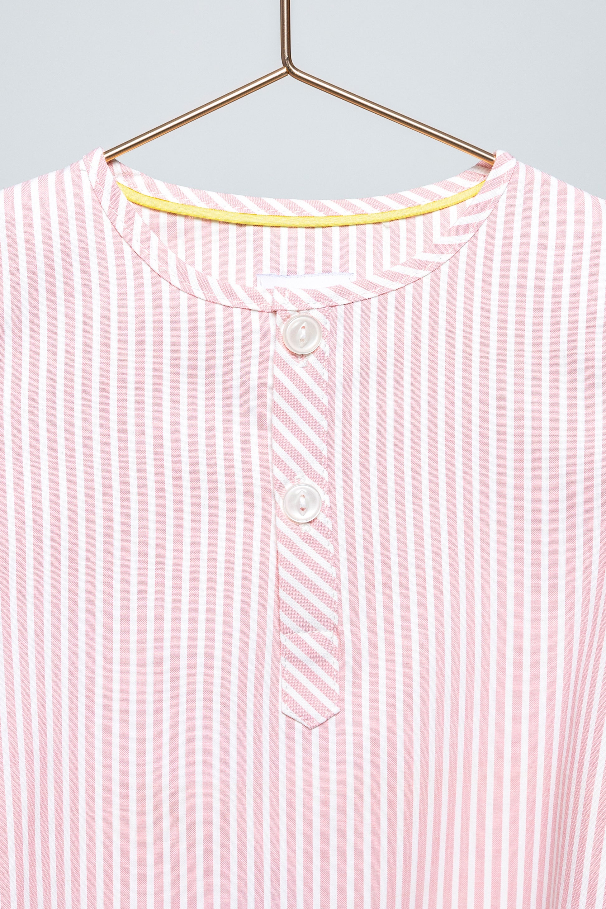 front view of pink and white pinstripes pajama top, detailed view of placket, good morning monsters woven pajamas, loungewear, sleepwear, loose-fitting pajamas, boys, girls, baby, unisex