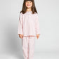 model wearing pink and white pinstripe pajamas, good morning monsters woven pajamas, loungewear, sleepwear, loose-fitting pajamas, boys, girls, baby, unisex