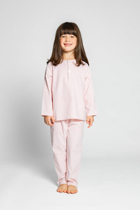 model wearing pink and white pinstripe pajamas, good morning monsters woven pajamas, loungewear, sleepwear, loose-fitting pajamas, boys, girls, baby, unisex