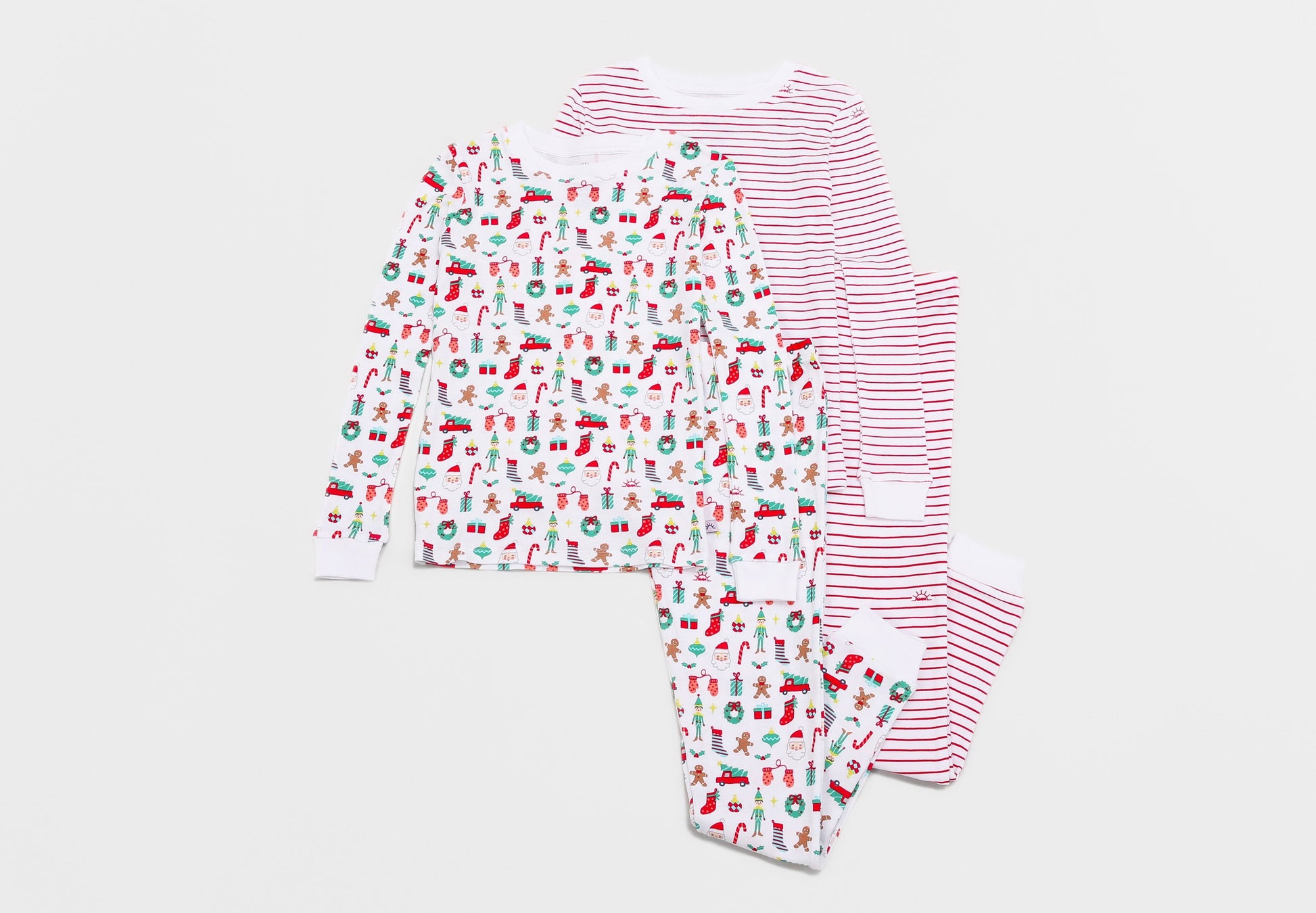 2 Pajama sets Top & Bottom - Christmas print (Christmas, festive, Santa, Elves, Classic Christmas, Holiday, Ornaments, Red Trucks), and Red Stripes pajama set.  
Pajamas are white, lightweight fabric with a vibrant Christmas print or Red Stripe print.   Pajamas are long-sleeved and made from GOTS certified, 100% organic cotton.
good morning monsters pajamas, loungewear, sleepwear, pajamas, boys, girls, baby, unisex