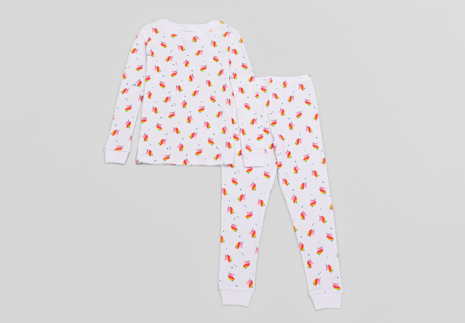 View of Pajama Set - Top & Bottom. 
 Pajamas are white fabric with a vibrant, colorful unicorn print.  Pajamas are long-sleeved and made from GOTS certified, 100% organic cotton.
good morning monsters pajamas, loungewear, sleepwear, pajamas, boys, girls, baby, unisex