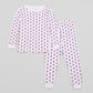 View of Pajama Set - Top & Bottom. 
 Pajamas are white fabric with a vibrant, tulips print (bright pink tulips with turquoise leaves).  Pajamas are long-sleeved and made from GOTS certified, 100% organic cotton.