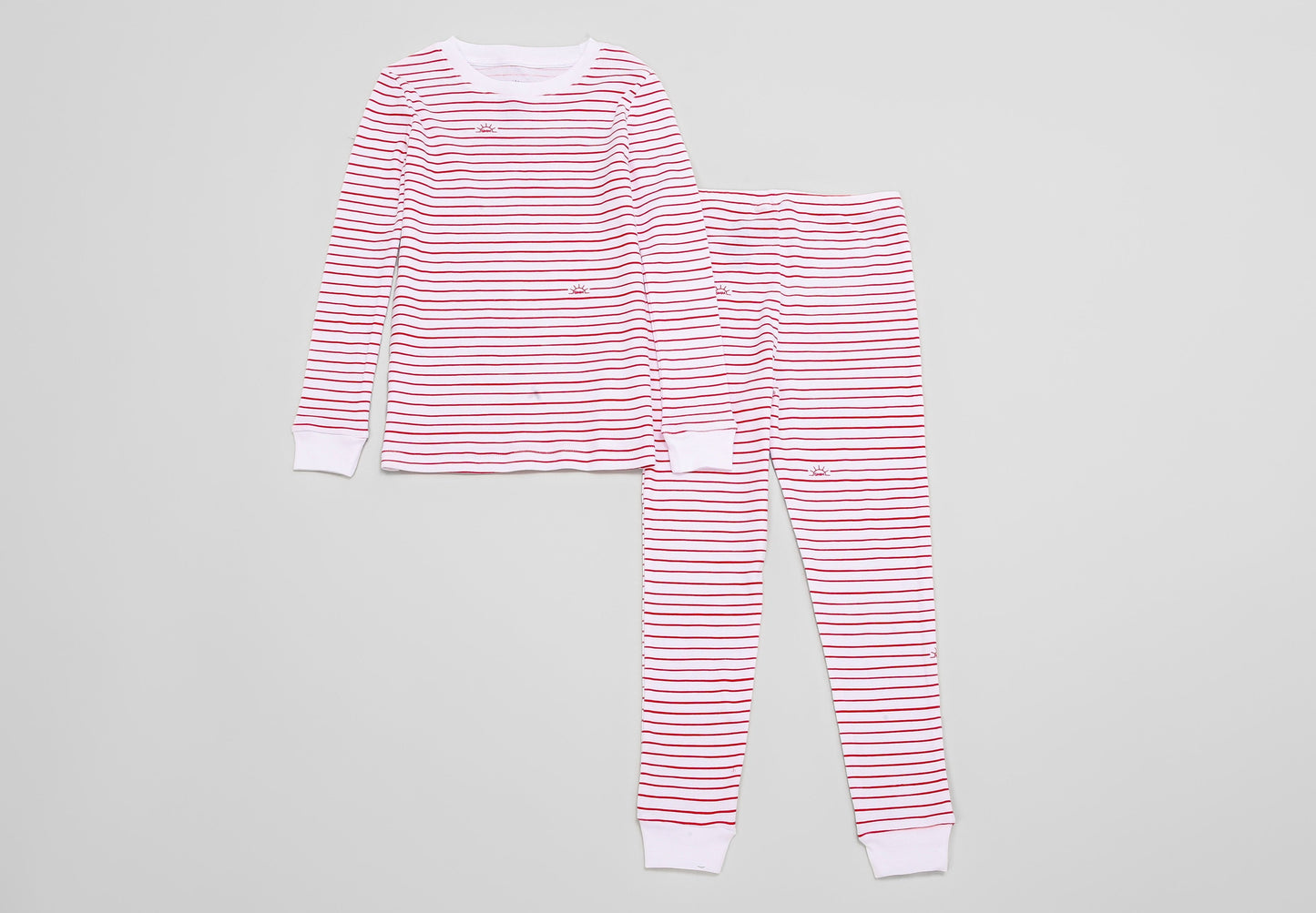 View of Pajama Set - Top & Bottom of red stripes print (with playful red stripes and our GMM logos also in red). 
 Pajamas are white fabric with the red stripes print.  Pajamas are long-sleeved and made from GOTS certified, 100% organic cotton.
good morning monsters pajamas, loungewear, sleepwear, pajamas, boys, girls, baby, unisex