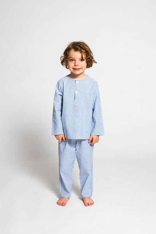 model wearing blue and white pinstripe pajamas, good morning monsters woven pajamas, loungewear, sleepwear, loose-fitting pajamas, boys, girls, baby, unisex